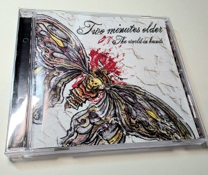 TWO MINUTES OLDER - THE WORLD IN HANDS (CD)